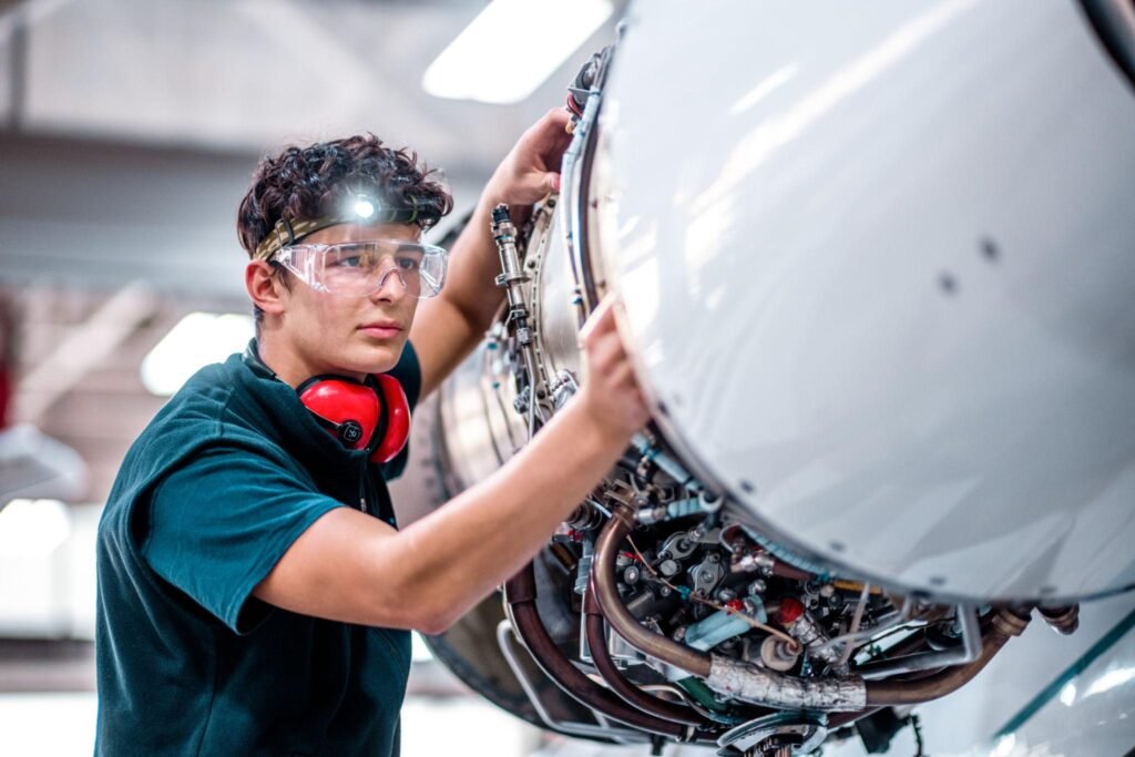 Aviation engineer working on jet engine. Ai in Airline operations