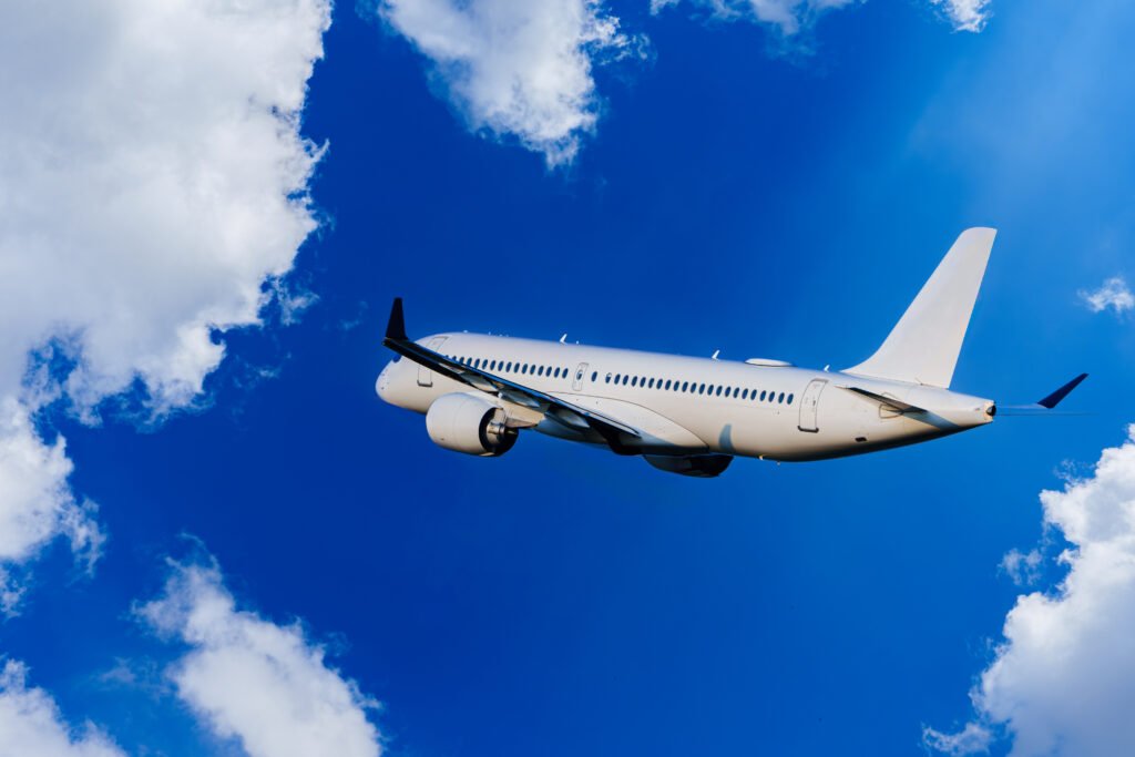 Passengers Commercial airplane flying above dramatic clouds. Concept of fast travel, holidays and business. Commercial transportation concept. Aviation Growth.