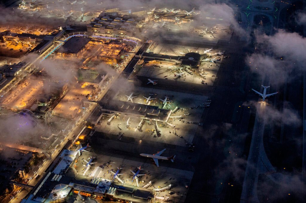 High angle view of airport illuminated at night, Los Angeles, California, USA. Aviation Growth.