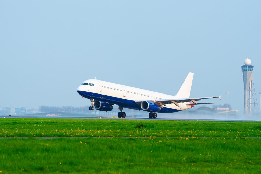 Passenger Plane Taking Off on Runway in Rainy Condition: Travel Destination Weather.