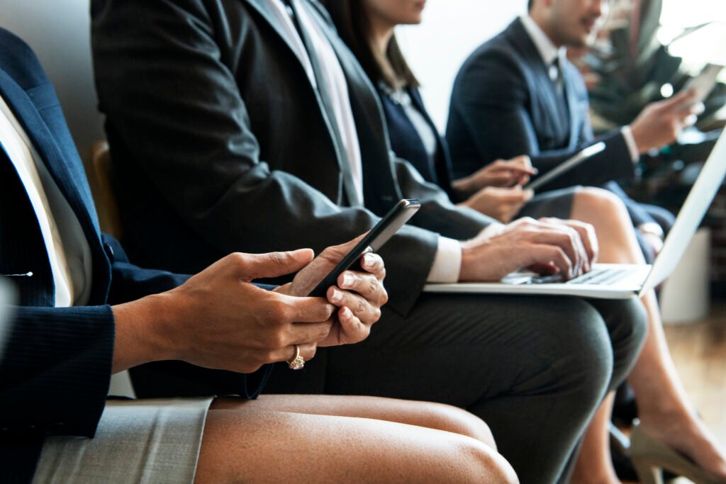 Business people using digital device. flight attendant recruitment.