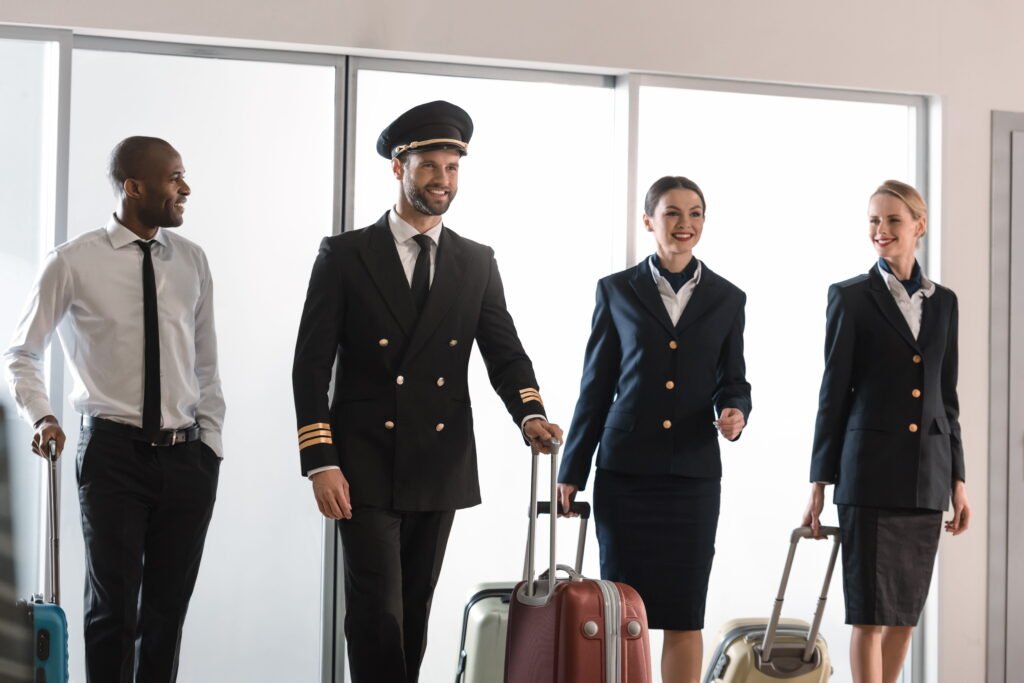 Aflight-crew-walking-with-luggage-in-airport-terminal. viation workforce gaps.